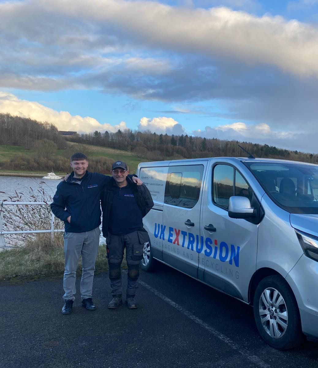 UK Extrusion employees stood next to van