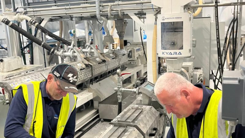 2 service engineers working on extrusion equipment
