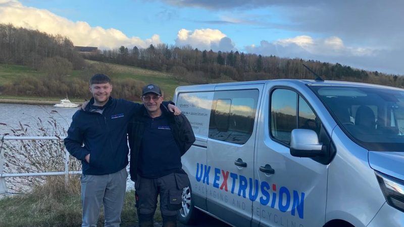 UK Extrusion employees stood next to van